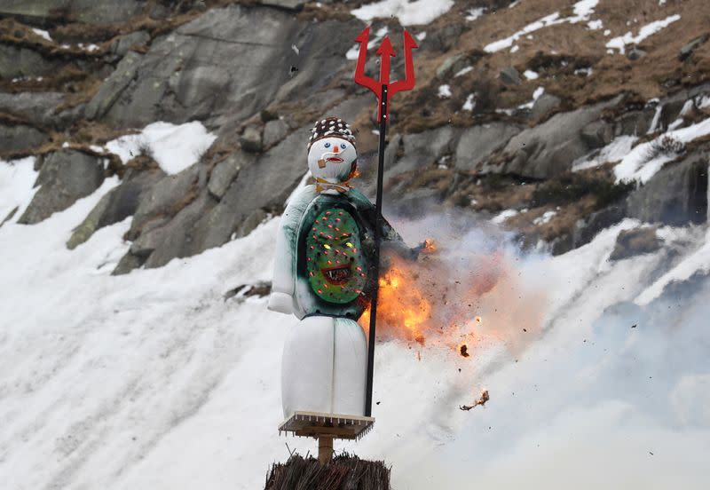 The Boeoegg, a snowman, burns in a bonfire on Devil's Bridge near Andermatt