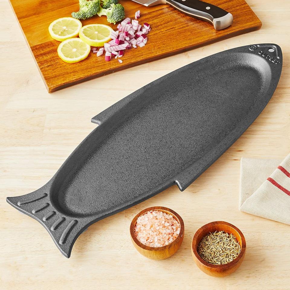 <p><a href="https://www.amazon.com/Outset-76376-Fish-Grill-Serving/dp/B077V8FCT2/ref=sr_1_16?tag=syn-yahoo-20&ascsubtag=%5Bartid%7C1782.g.44209375%5Bsrc%7Cyahoo-us" rel="nofollow noopener" target="_blank" data-ylk="slk:Shop Now;elm:context_link;itc:0;sec:content-canvas" class="link ">Shop Now</a></p><p>Fish Cast Iron Grill and Serving Pan</p><p>Outset</p><p>$33.99</p><span class="copyright">Amazon</span>