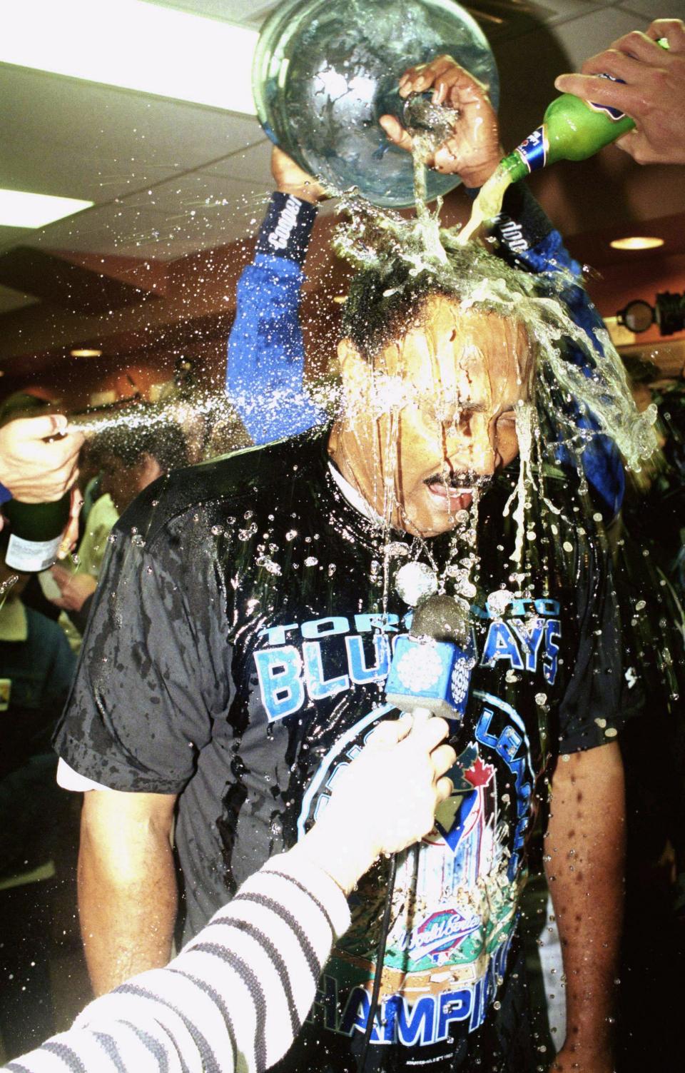 Toronto Blue Jays manager Cito Gaston gets doused in the locker room as his players celebrate their 6-3 win over the Chicago White Sox on Tuesday, Oct. 12, 1993 in Chicago, giving them the American League Championship, 4 games to 2.