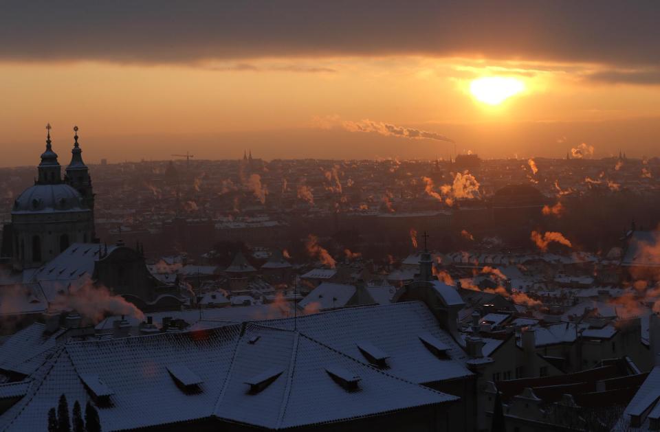 Smoke rises from chimneys during a freezing winter morning in Prague, Czech Republic, Wednesday, Jan. 11, 2017. Central Europe has been hit by unusually freezing weather in recent days. (AP Photo/Petr David Josek)