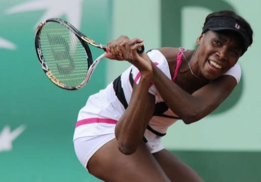 US Venus Williams hits a return to Argentina's Paula Ormaechea during their Women's Singles 1st Round tennis match of the French Open tennis tournament at the Roland Garros stadium, in Paris. Williams won 4-6, 6-1, 6-3