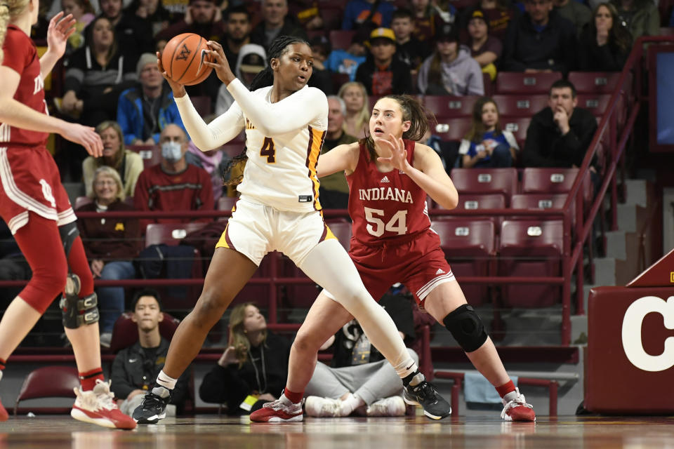 Minnesota forward Alanna Micheaux (4) tries to get past Indiana forward Mackenzie Holmes (54) during the second half of an NCAA college basketball game on Wednesday, Feb 1, 2023, in Minneapolis. Indiana won 77-54. (AP Photo/Craig Lassig)