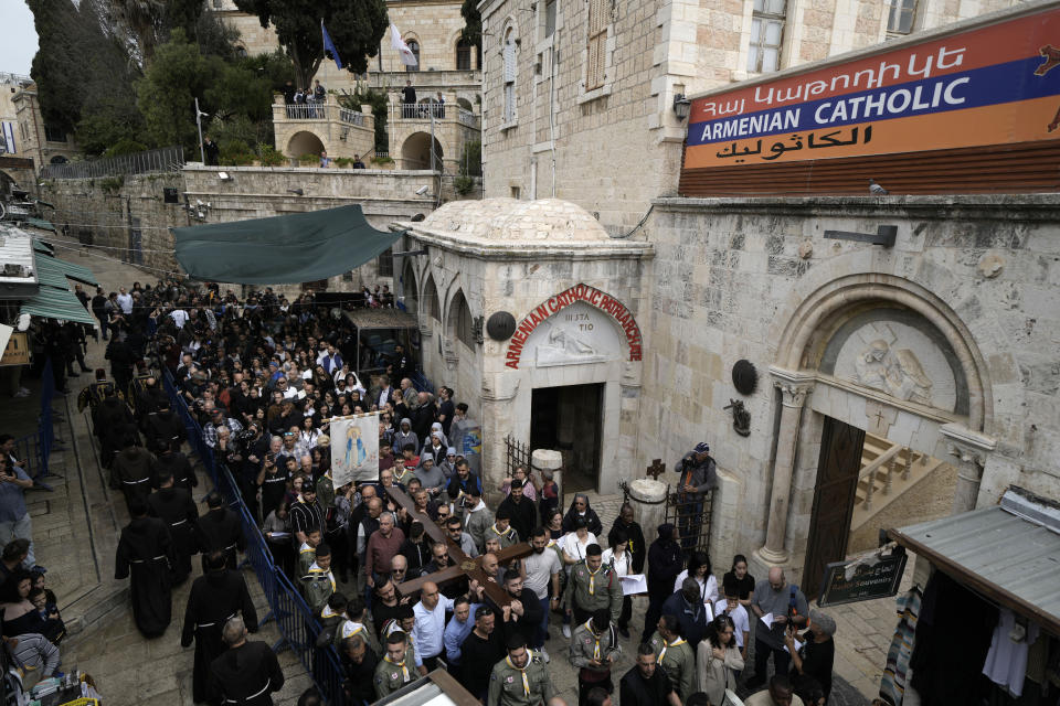 Christians walk the Way of the Cross procession that commemorates Jesus Christ's crucifixion on Good Friday, in the Old City of Jerusalem, Friday, March 29, 2024. (AP Photo/Leo Correa)