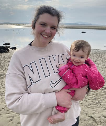 <p>Courtesy Rebecca Moss</p> Rebecca Moss holding her daughter Harper, whose father Thomas GIbson died in June 2023