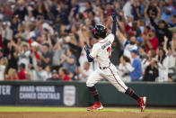 Atlanta Braves' Dansby Swanson reacts after hitting a solo home run in the first inning of a baseball against the New York Mets, Sunday, Oct. 2, 2022, in Atlanta. (AP Photo/Hakim Wright Sr.)