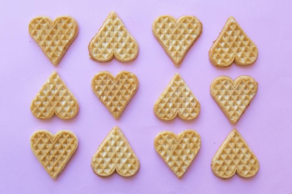 heart shaped waffles, which might be enjoyed with friends on galentine's day, celebrated the day before valentine's day