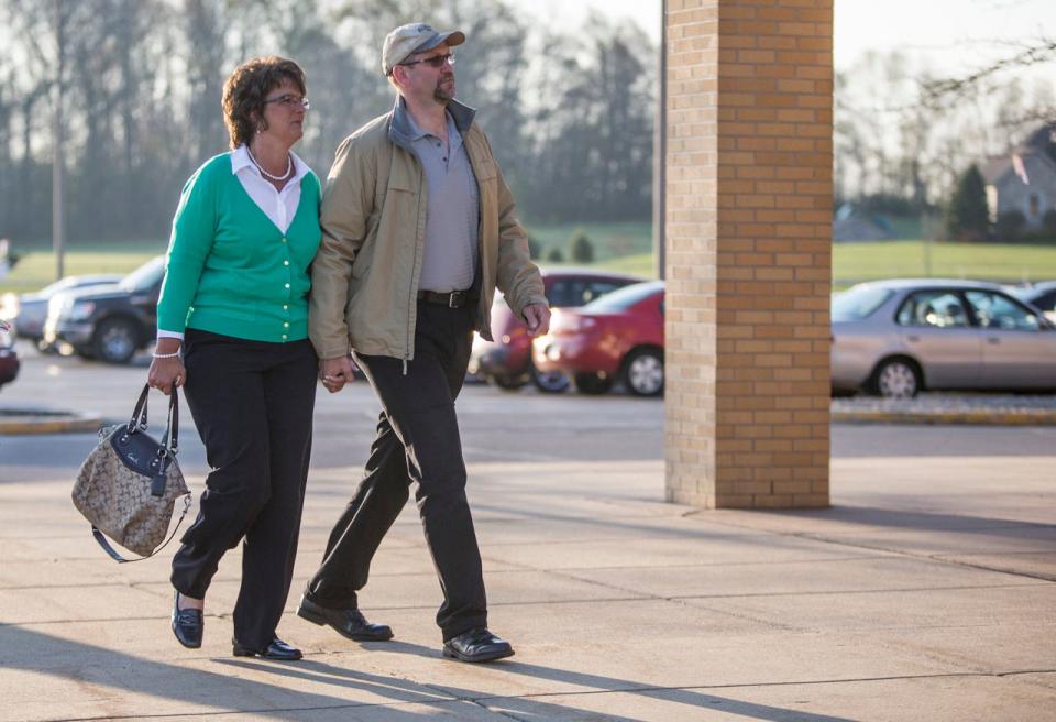 Rep. Jackie Walorski (R-IN2), left, holds hands with her husband, Dean Swihart, as they show up to vote during the primary election on Tuesday, May 5, 2014, at Jimtown High School in Elkhart.