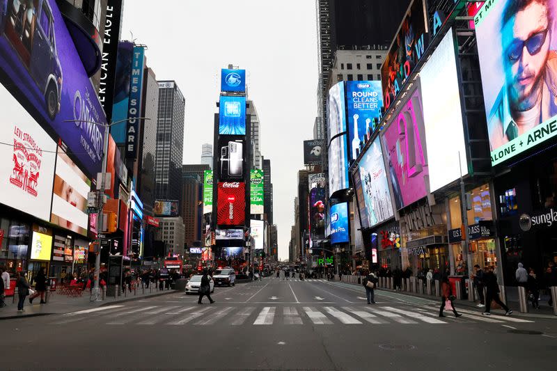 FILE PHOTO: A nearly empty 7th Avenue in Times Square is seen at rush hour after it was announced that Broadway shows will cancel performances due to the coronavirus outbreak in New York