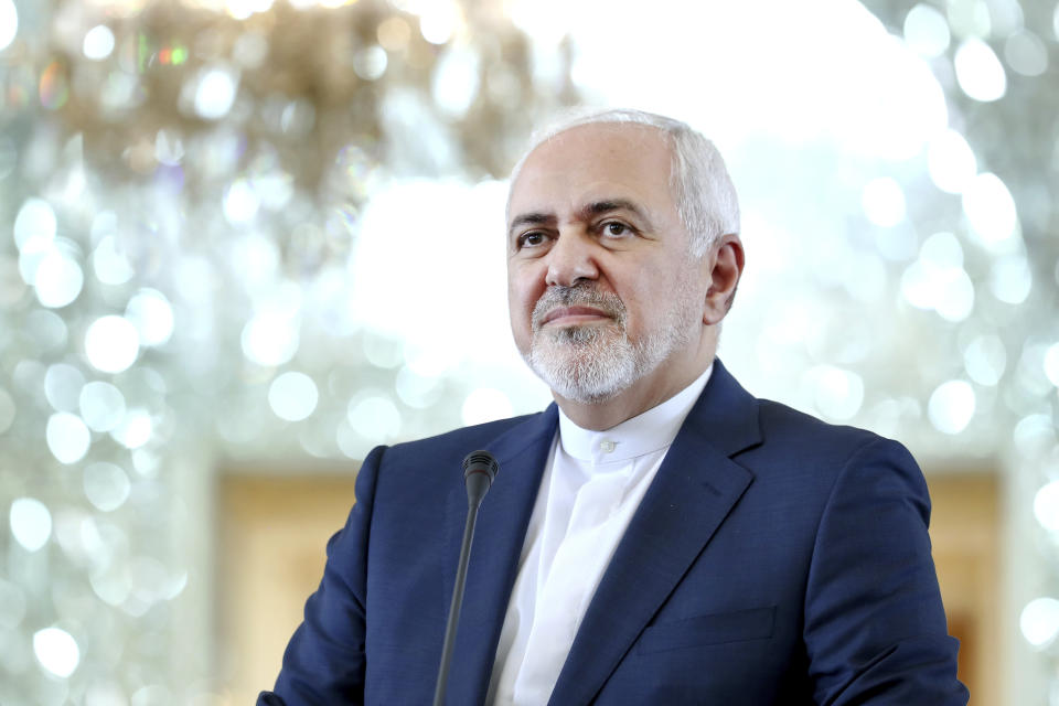 In this Monday, June 10, 2019 photo, Iranian Foreign Minister Mohammad Javad Zarif speaks during a press conference with his German counterpart Heiko Maas after their talks in Tehran, Iran. Zarif acknowledged Monday, July 1, 2019, Iran had broken the limit set on its stockpile of low-enriched uranium by the 2015 nuclear deal, marking its first major departure from the unraveling agreement a year after the U.S. unilaterally withdrew from the accord. (AP Photo/Ebrahim Noroozi)