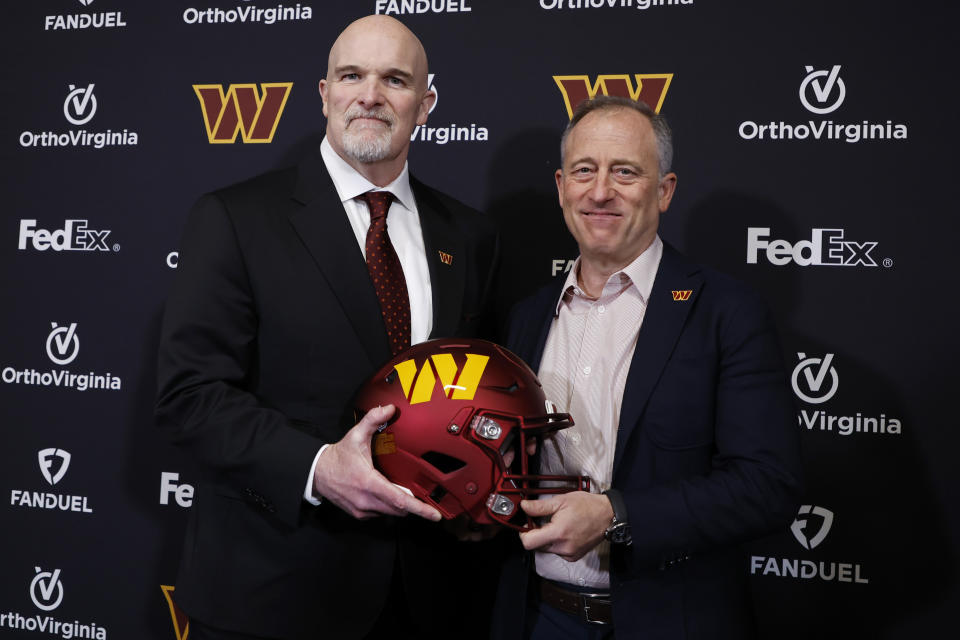 Feb 5, 2024; Ashburn, VA, USA; Washington Commanders head coach Dan Quinn (L) poses for a picture with Commanders managing partner Josh Harris (R) at Quinn’s introductory press conference at Commanders Park. Mandatory Credit: Geoff Burke-USA TODAY Sports