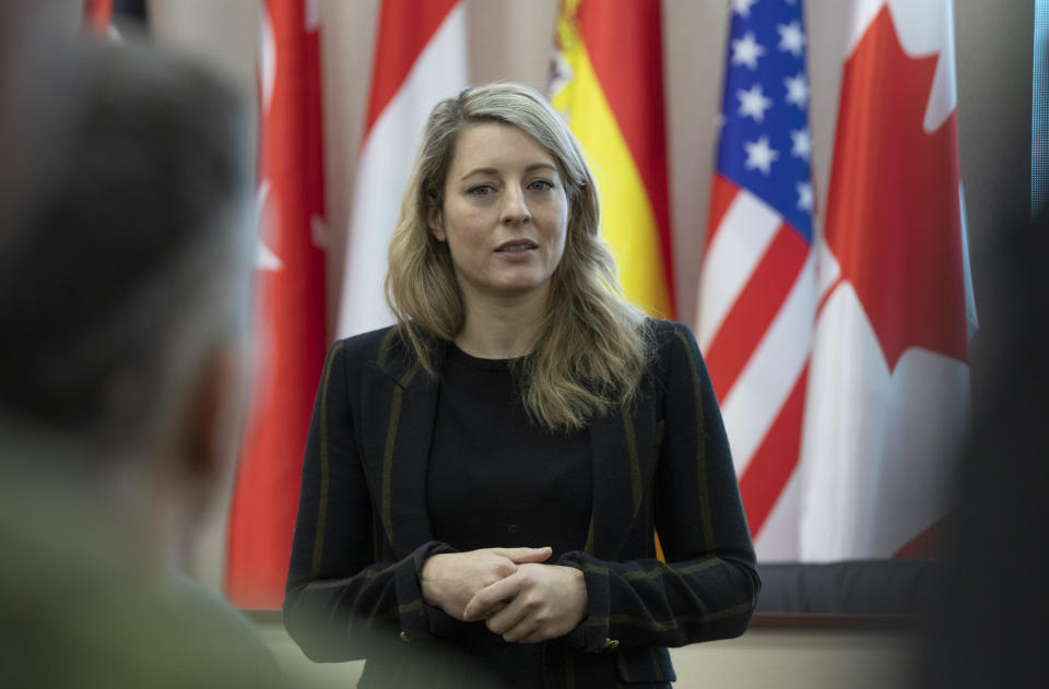 In this photo provided by Ukrainian National Guard Press Office Canada's Minister of Foreign Affairs Melanie Joly speaks during her visit to the National Guard base close to Kyiv, Ukraine, Tuesday, Jan. 18, 2022. (Ukrainian National Guard Press Office via AP)