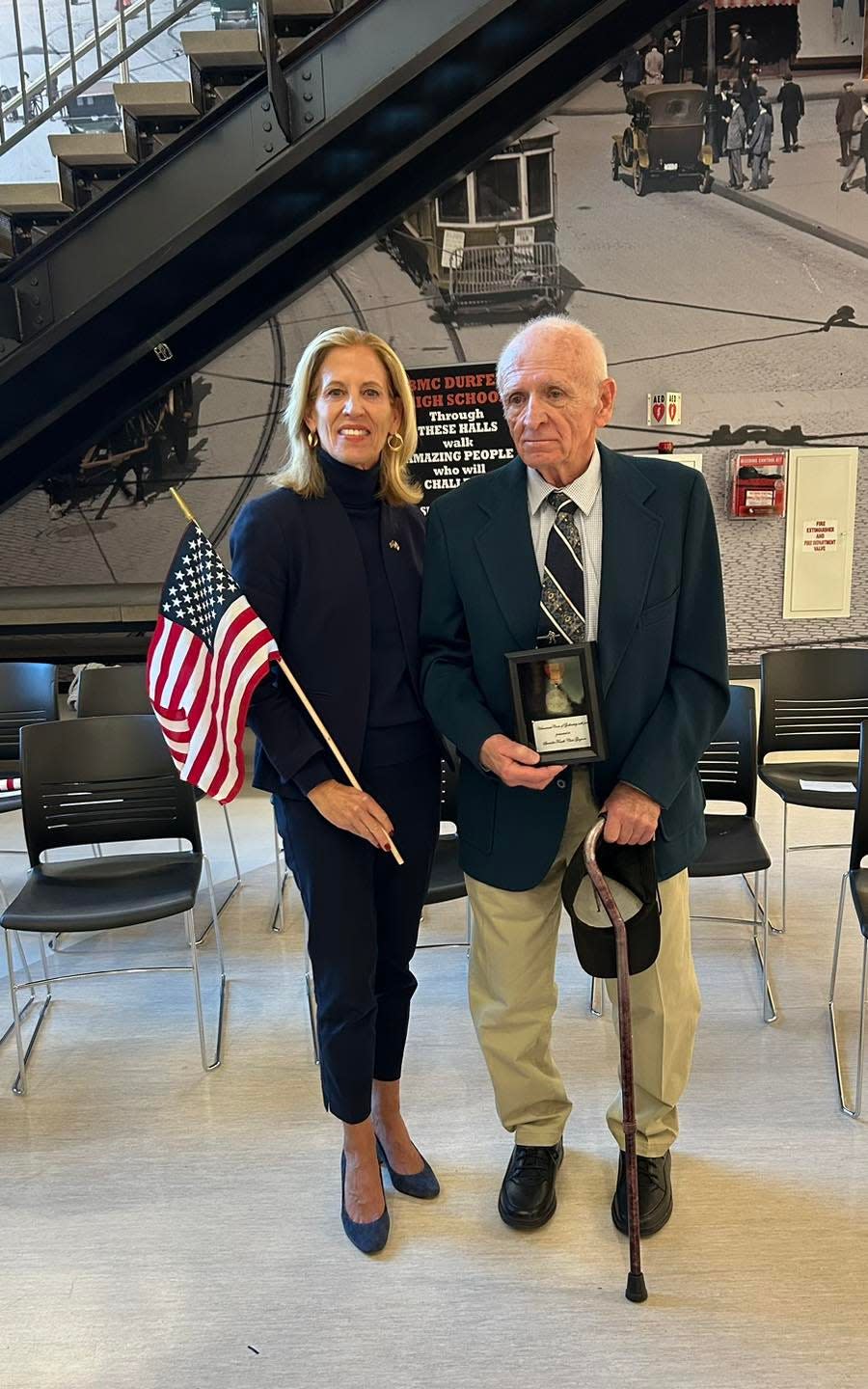 Specialist Fourth Class Charles Norman Gagnon and State Rep. Carole Fiola. Gagnon received the Vietnamese Cross of Gallantry at the Fall River Veterans Day Ceremony at B.M.C. Durfee High School, nearly 58 years after he was awarded the recognition.
