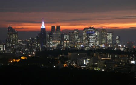 High-rise buildings are seen at the Shinjuku business district during sunset in Tokyo, Japan, May 31, 2018. REUTERS/Toru Hanai