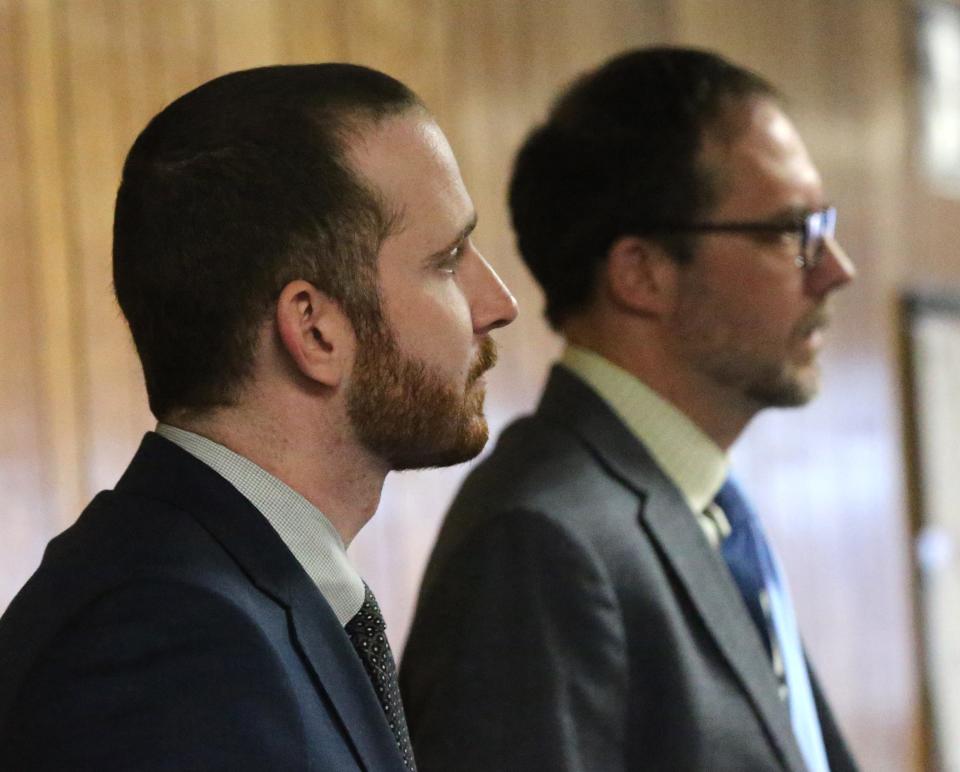 Prosecuters Brian Greklek-McKeon, left, and Peter Hinckley react to the second-degree murder conviction in the trial of Timothy Verrill in Strafford County Superior Court in Dover Wednesday, April 9, 2024.
