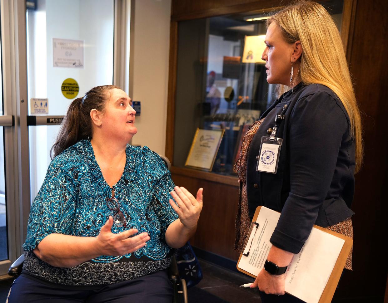 Danni Legg, left, is greeted by school board member Kendra Wesson on Sept. 28 during an Oklahoma State Board of Education meeting at the Hodges building in the Capitol complex.
