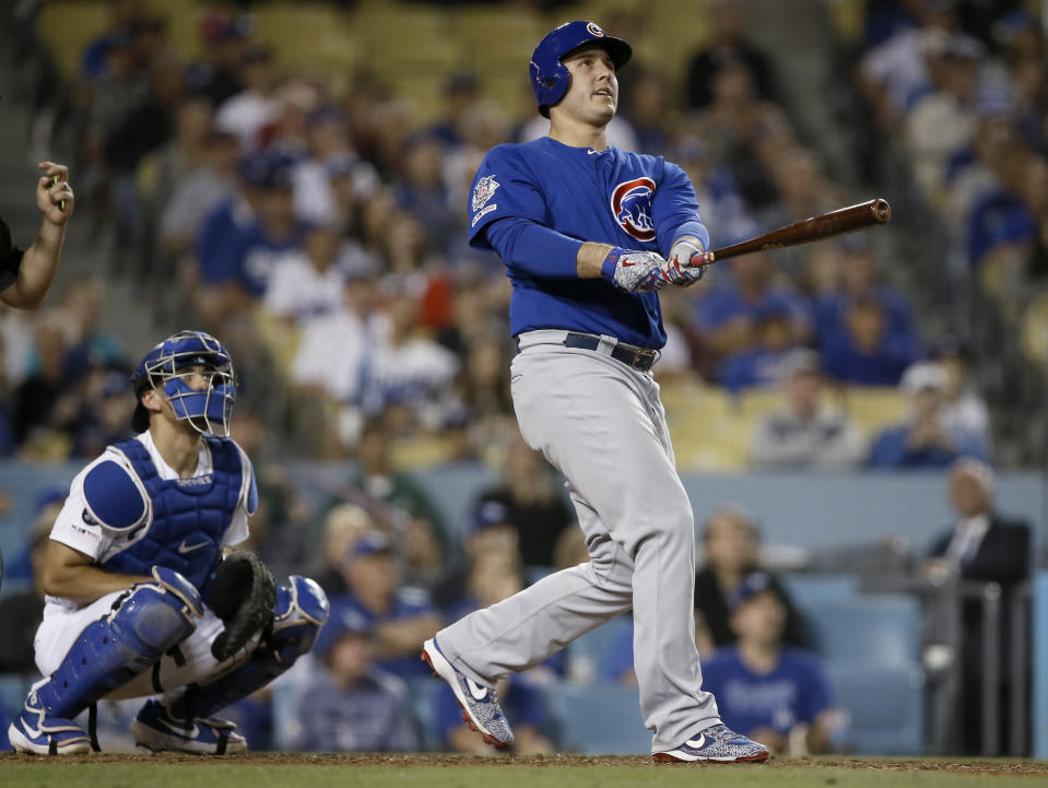 Chicago Cubs' Anthony Rizzo and Los Angeles Dodgers catcher Austin Barnes watches Rizzo's two-run home run during the ninth inning of a baseball game in Los Angeles, Saturday, June 15, 2019. (AP Photo/Alex Gallardo)