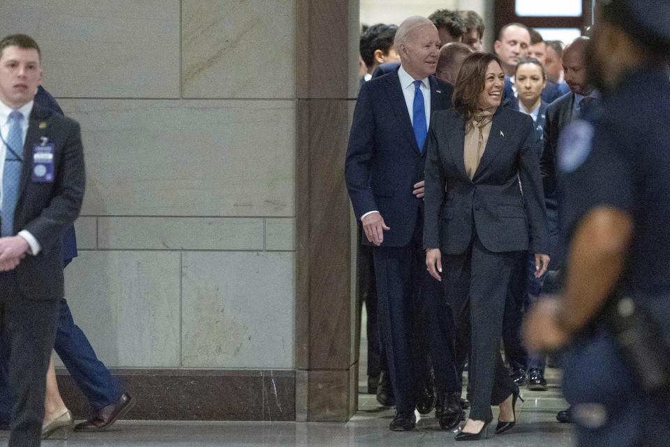 President Joe Biden accompanied by Vice President Kamala Harris arrives at the National Prayer Breakfast at the Capitol in Washington, Thursday, Feb. 2, 2023. (AP Photo/Jose Luis Magana)