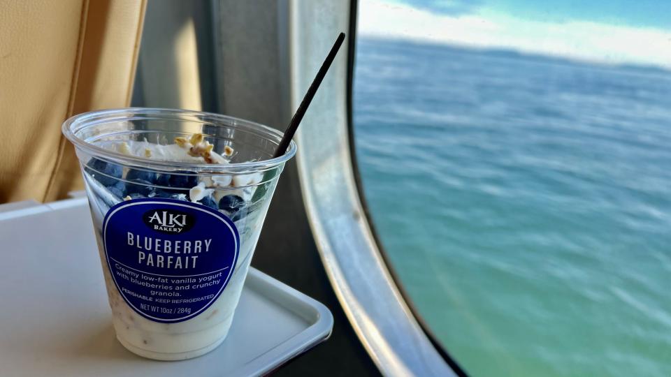 ALKI Bakery blueberry parfait in plastic container in front of window on the Victoria ferry