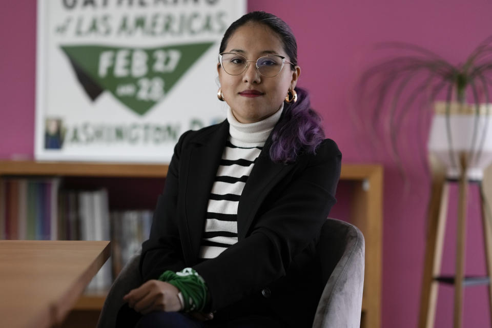Activist Cinthya Ramirez poses for a photo in the office of Catholics for the Right to Decide, in Mexico City, Monday, Dec. 4, 2023. “You might think that one cannot be a feminist and a Catholic,” said activist Ramírez. “But being women of faith does not mean that we oppose progressivity, human rights or sexual diversity.” (AP Photo/Eduardo Verdugo)