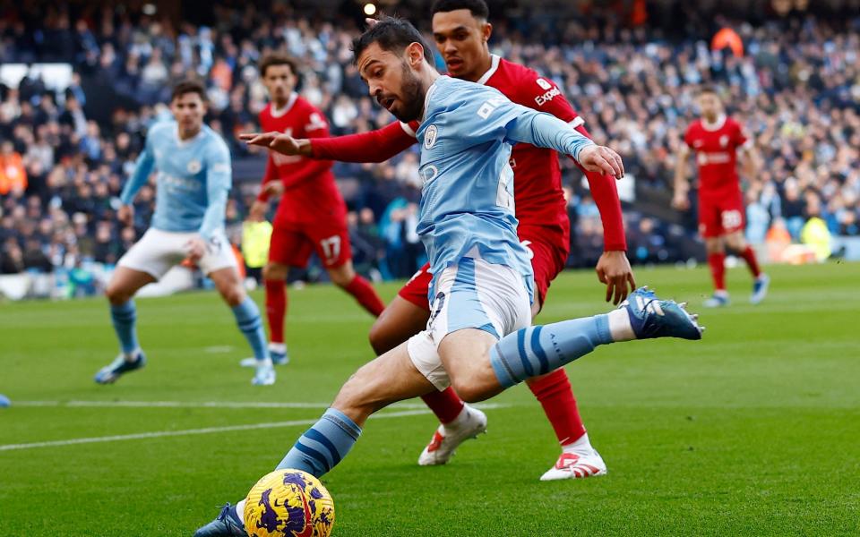 Manchester City's Bernardo Silva in action with Liverpool's Trent Alexander-Arnold