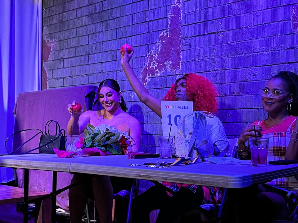 (From left) Selena West, Ebonee Paragon Mizrahi and Sassy Diazz, the judges for the back-to-school-themed vogue night at Stacy's at Melrose, give someone in the realness category a 10 on Aug. 4, 2022.