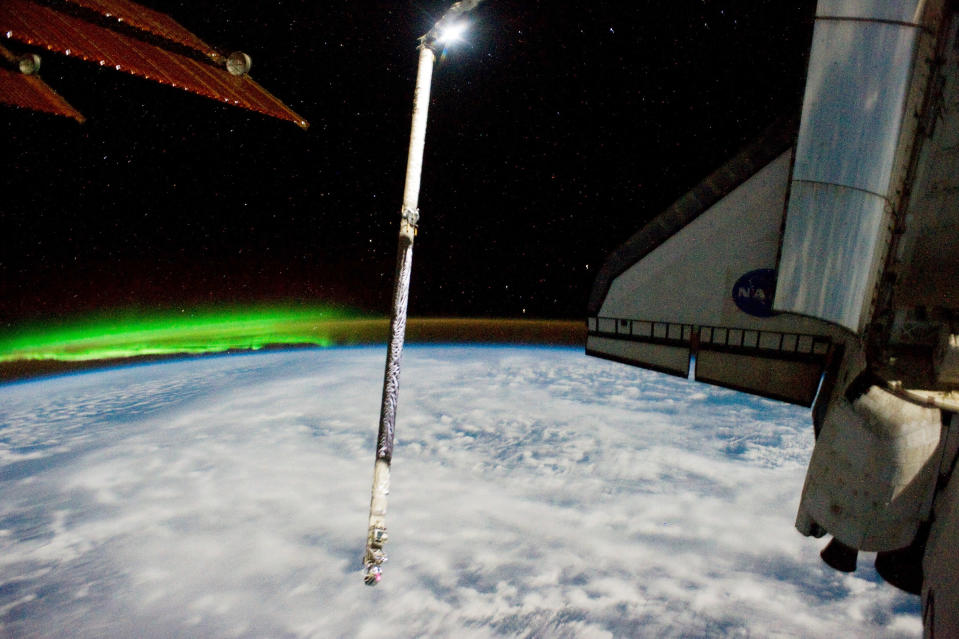 In this handout image provided by the National Aeronautics and Space Administration (NASA), the Southern Lights or Aurora Australis and the port side wing of NASA space shuttle Atlantis can be seen from the International Space Station July 14, 2011 in space. Space shuttle Atlantis is on the last leg of a 12-day mission to the International Space Station where it delivered the Raffaello multi-purpose logistics module packed with supplies and spare parts. This was the final mission of the space shuttle program, which began on April 12, 1981 with the launch of Colombia. (Photo by NASA via Getty Images)