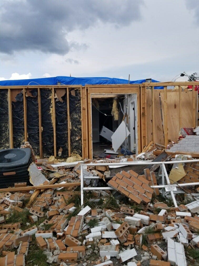 A photo captures the damage to the Curtis V. Cooper Primary Care facility from a tornado that came through Ellabell last April.