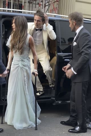 <p>BACKGRID</p> Victoria Beckham, Cruz Beckham and David Beckham arrive in London on April 20