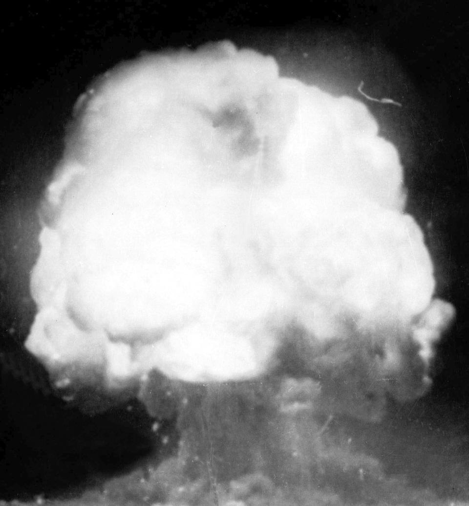 FILE - The first U.S. atom bomb explodes during a test in Alamogordo, N.M., July 16, 1945. The cloud went 40,000 feet in the air, as viewed by an automatic camera six miles away from the site. The Biden administration has reversed a decades-old decision to revoke the security clearance of Dr. J. Robert Oppenheimer, the physicist called the father of the atomic bomb for his leading role in World War II’s Manhattan Project. (AP Photo, File)