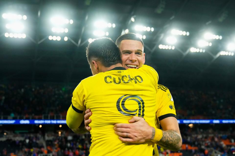 Crew forward Cucho Hernandez celebrates with Christian Ramirez after Saturday's win over FC Cincinnati.