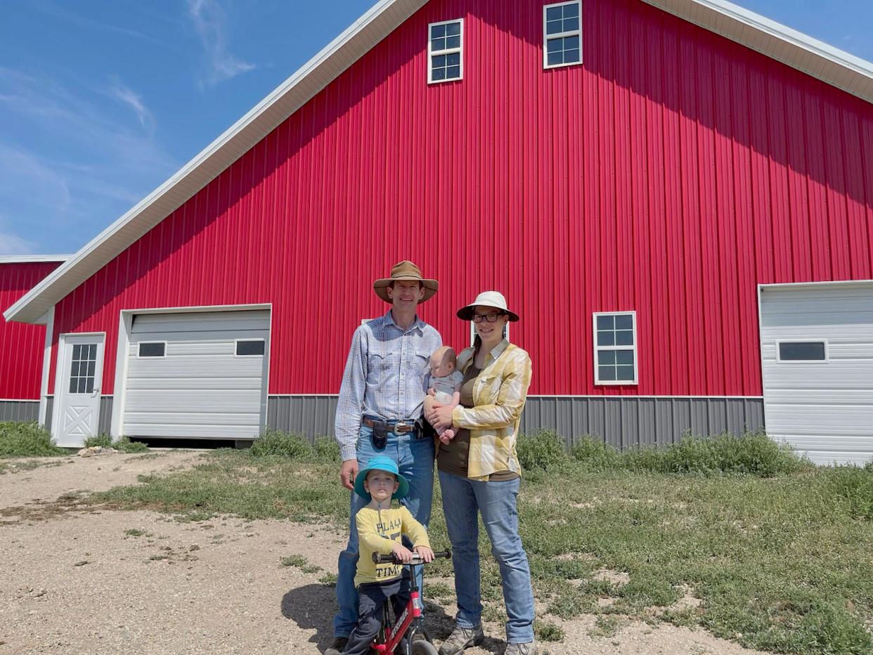 Hyde County cattle rancher Seth Zilverberg poses with his wife Bridget (holding 4-month-old daughter Avila) and 2-year-old son Solanus at the Bar JZ South Ranch.