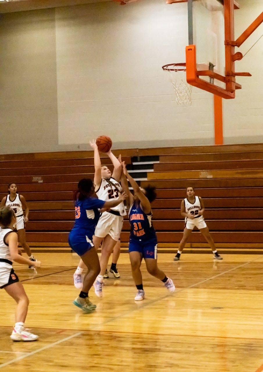 Summerfield's Abby Haller puts up a shot between two defenders in the season opener against Lincoln Park Thursday, December 1, 2022.