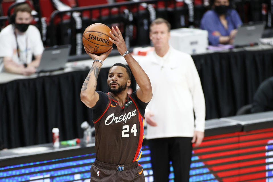 Norman Powell in a shooting motion with the ball over his head.