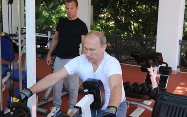 Vladimir Putin shows Russian Prime Minister Dmitry Medvedev how it's done. Source: Reuters.