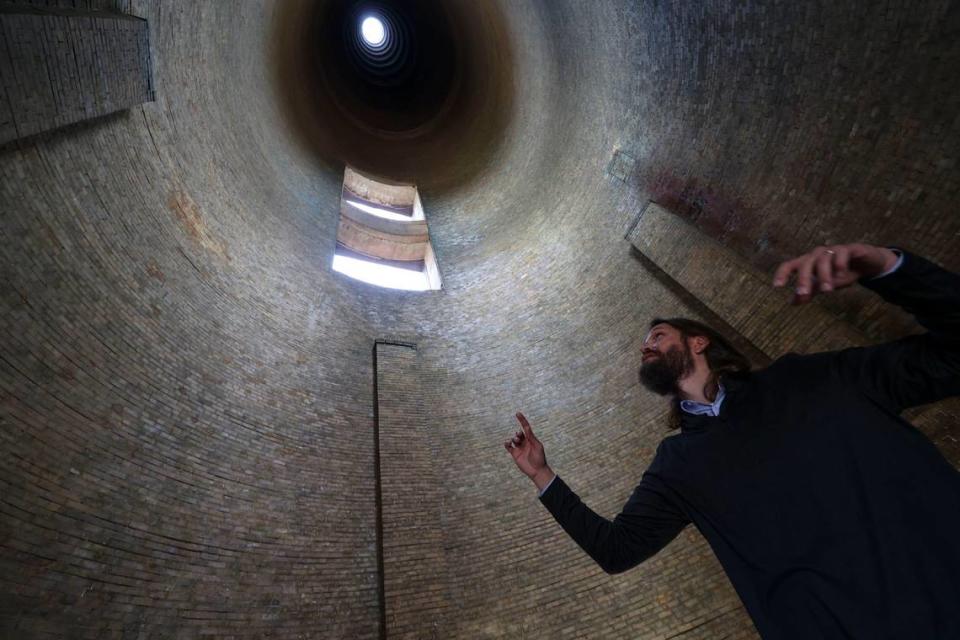 Vistra project development director David Yeager looks at the inside of obsolete technology, a 450-foot-tall smoke stack at the Morro Bay Power Plant, on April 24, 2024. David Middlecamp/dmiddlecamp@thetribunenews.com