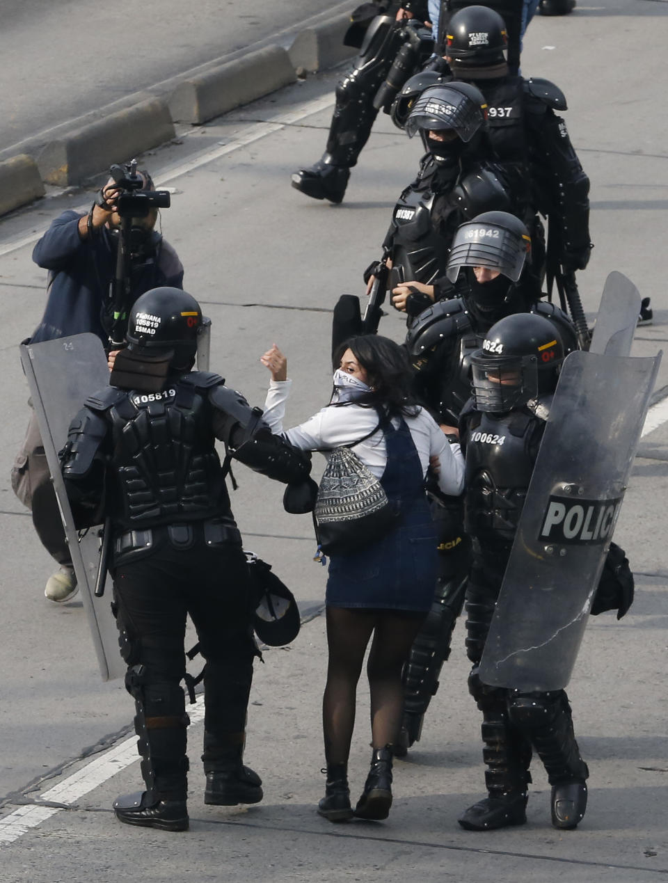 An university student is detained by the police during a protest asking for a hike in the budget for public higher education, in Bogota, Colombia, Thursday, Nov. 15, 2018. The so-called “Pencil March” is the latest in more than a half-dozen street protests in recent months demanding the government step up funding for education. (AP Photo/Fernando Vergara)