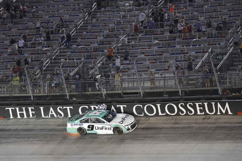 Chase Elliott celebrates does a victory lap after winning a NASCAR All-Star auto race at Bristol Motor Speedway in Bristol, Tenn, Wednesday, July 15, 2020. (AP Photo/Mark Humphrey)