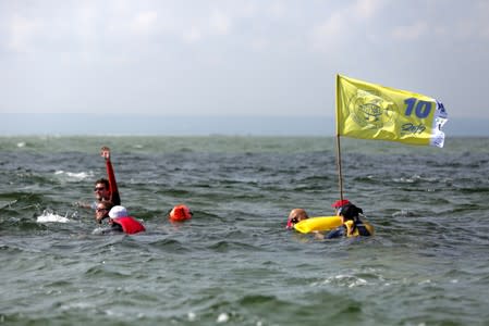 People take part in the annual event called the Herring March in Puck Bay