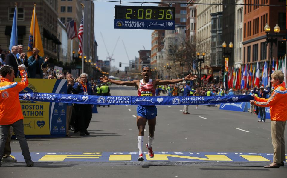 Meb Keflezighi of the U.S. reacts as he comes to the finish line at the 118th running of the Boston Marathon in Boston, Massachusetts April 21, 2014. (REUTERS/Brian Snyder)