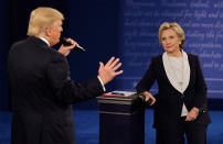 <p>Democratic presidential nominee Hillary Clinton listens to Republican presidential nominee Donald Trump during the second presidential debate at Washington University in St. Louis, Sunday, Oct. 9, 2016. (Photo: John Locher/AP) </p>