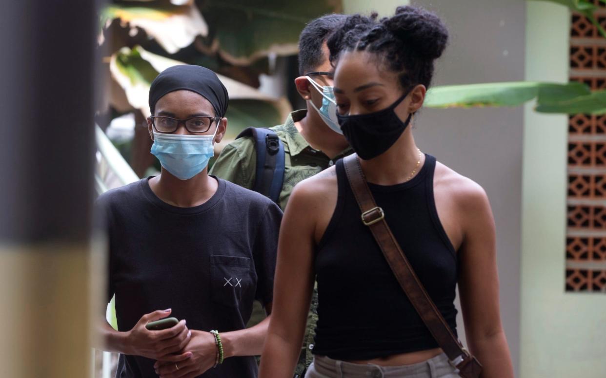 Kristen Gray and her girlfriend Saundra Alexander are tested for the coronavirus at a hospital in Bali - Firdia Lisnawati /AP