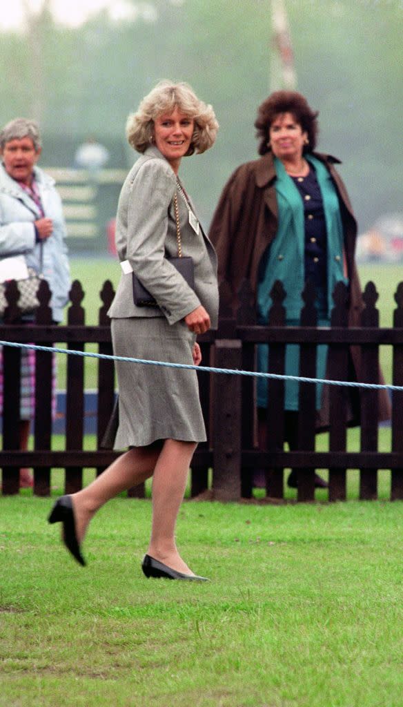 <p>Camilla sported a '90s-appropriate skirt suit with broad shoulder pads in gray to the Queen's Cup polo match at Windsor in 1992. </p>