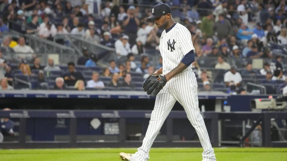 Jun 22, 2023; Bronx, New York, USA; New York Yankees pitcher Domingo German (0) walks to the dugout after being taken out of the game against the Seattle Mariners during the fourth inning at Yankee Stadium.