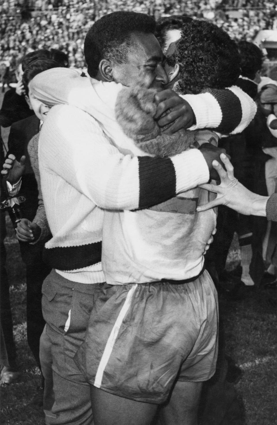 Pele embracing a team mate after Brazil beat Czechoslovakia 3- 1 in the final of the 1962 World Cup, Estadio Nacional, Santiago, Chile, 17th July 1962. Pele missed the final through injury. (Getty Images)