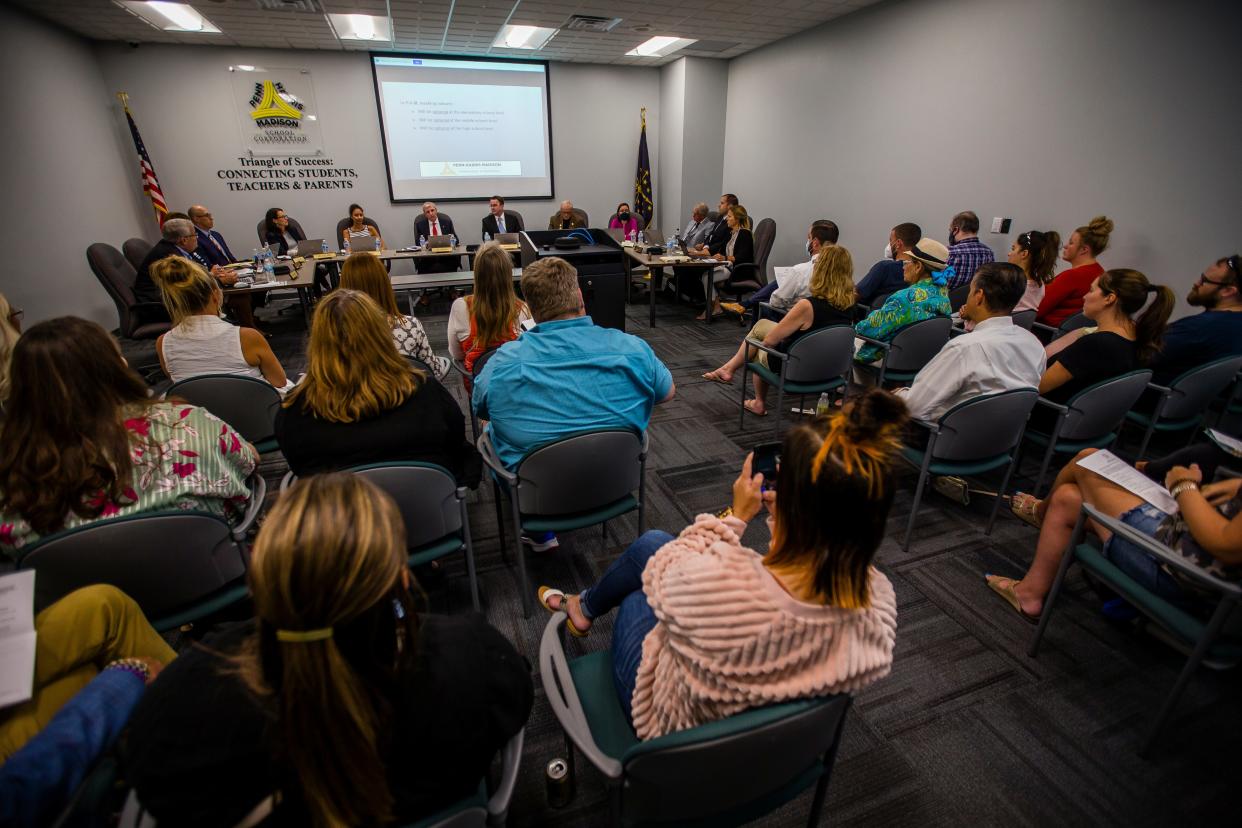 Attendees listen to a plan for optional masks during a Penn-Harris-Madison School Corporation meeting Monday, Aug. 9, 2021, at the administration building in Mishawka.