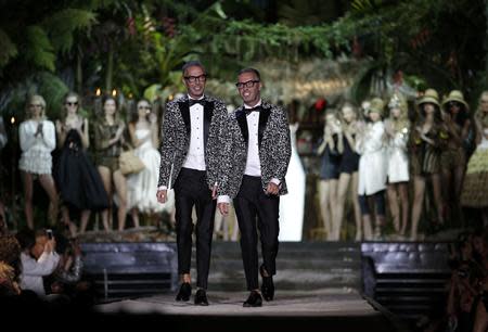 Dean and Dan Caten acknowledge the audience at the end of the Dsquared2 Spring/Summer 2014 collection during Milan Fashion Week September 18, 2013. REUTERS/Max Rossi