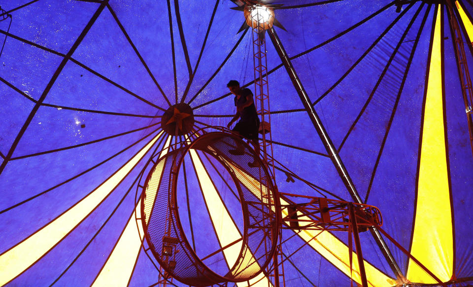 Acrobat Joel Condori trains during the COVID-19 lockdown that closed the circus four months ago in El Alto, Bolivia, Monday, June 15, 2020. “Something to eat always falls from somewhere. There's no shortage of work. At first, we made food to sell, but it didn't go well. The competition was tough with the ladies from the neighborhood and we changed direction.” (AP Photo/Juan Karita)