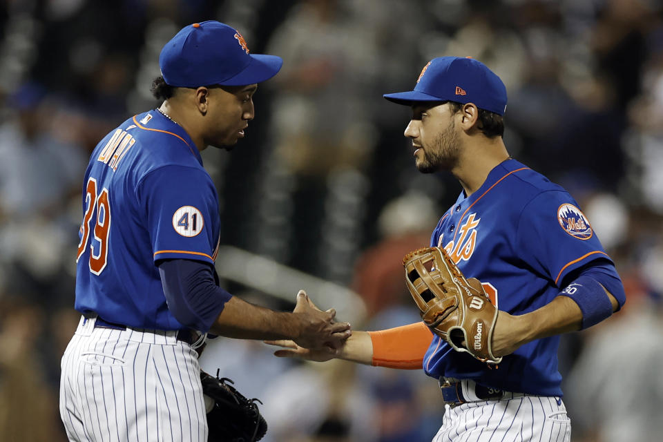 New York Mets' Michael Conforto, right, celebrates with Edwin Diaz after the Mets defeated the Miami Marlins 3-1 in the second game of a baseball doubleheader Tuesday, Aug. 31, 2021, in New York. (AP Photo/Adam Hunger)
