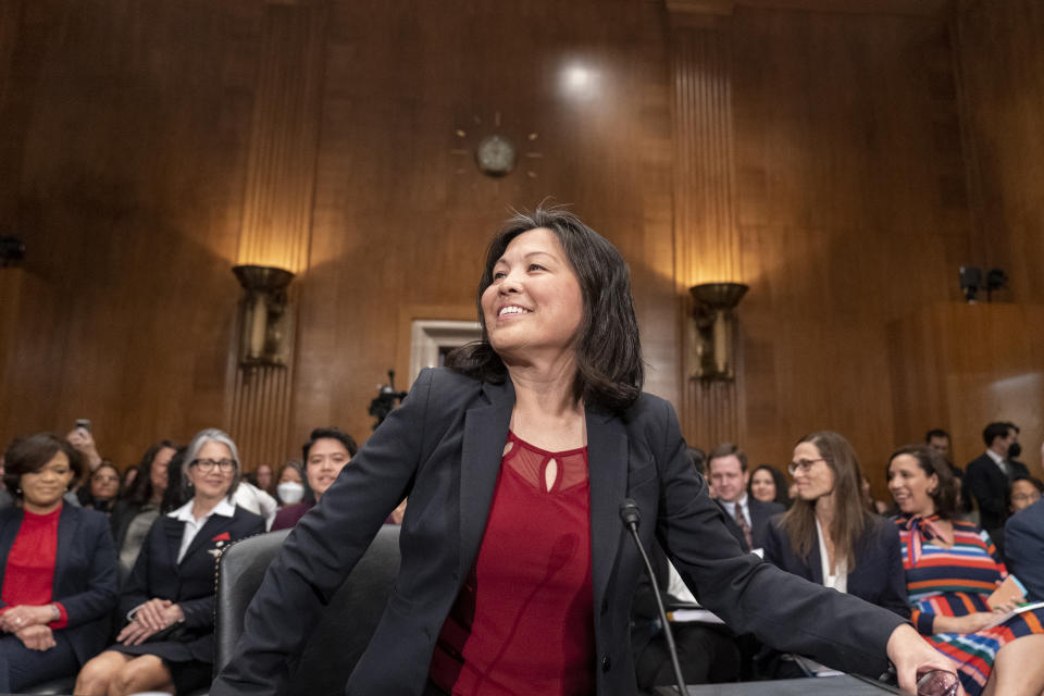 Julie Su, center, takes her seat for a Senate Health, Education, Labor and Pensions confirmation hearing for her to be the Labor Secretary, on Capitol Hill, Thursday, April 20, 2023, in Washington. (AP Photo/Alex Brandon)