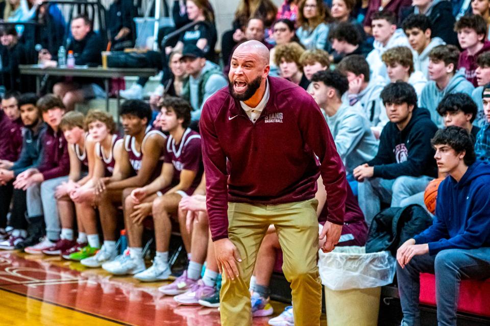 Bishop Stang coach Colbey Santos reacts to a call on the court.